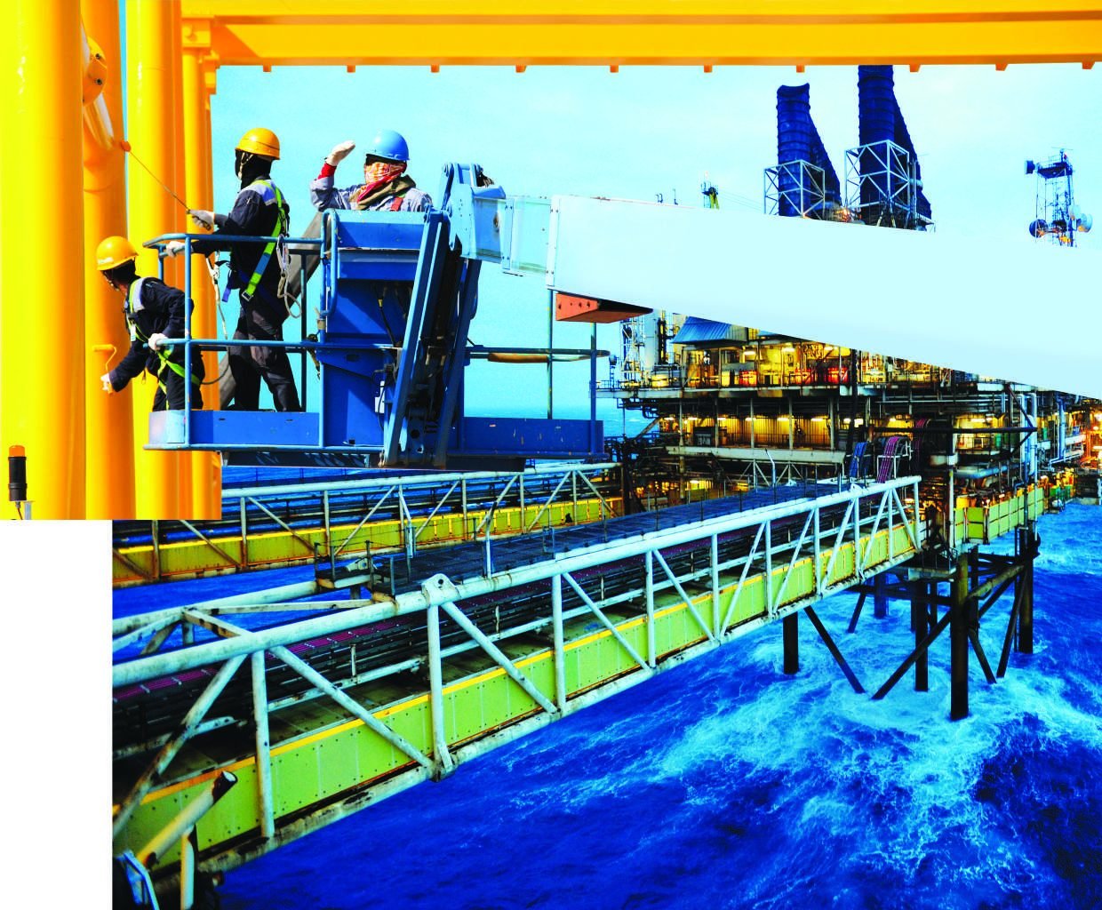 Maintenance crew working on an offshore platform walkway