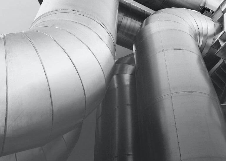 Large spiral duct runs supported on a structural steel frame