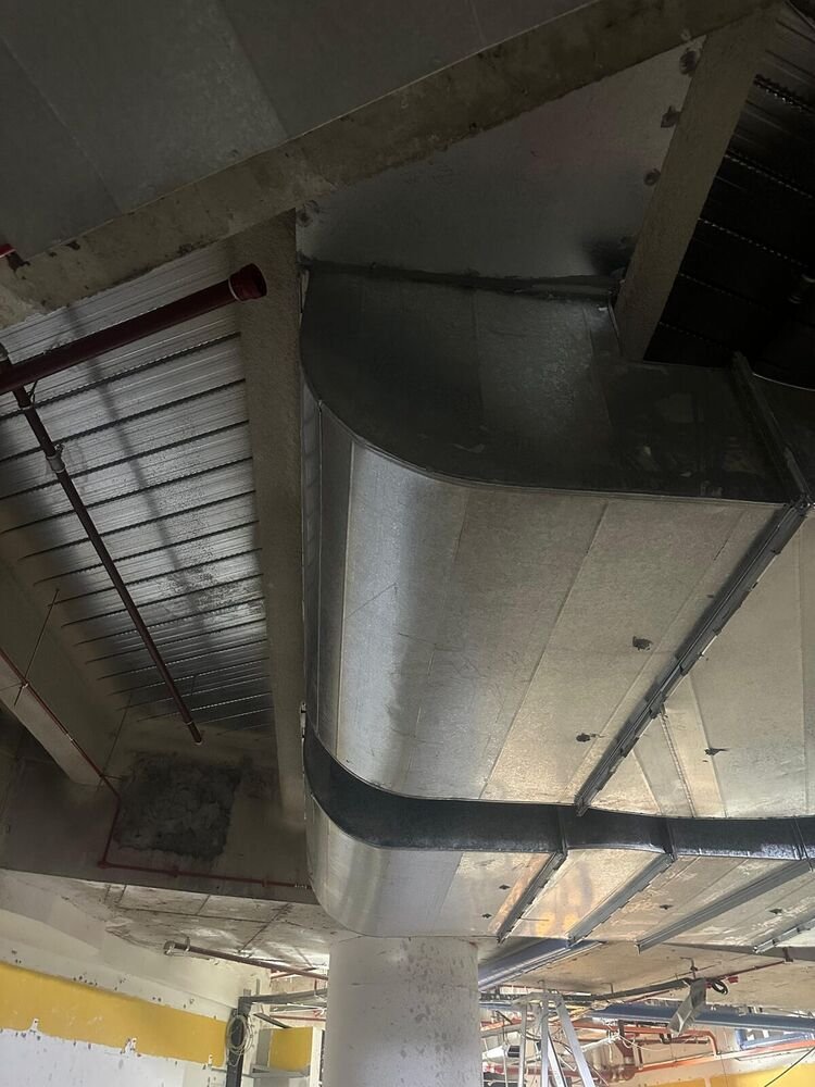 Rectangular duct mains and branches installed to the soffit of a commercial building