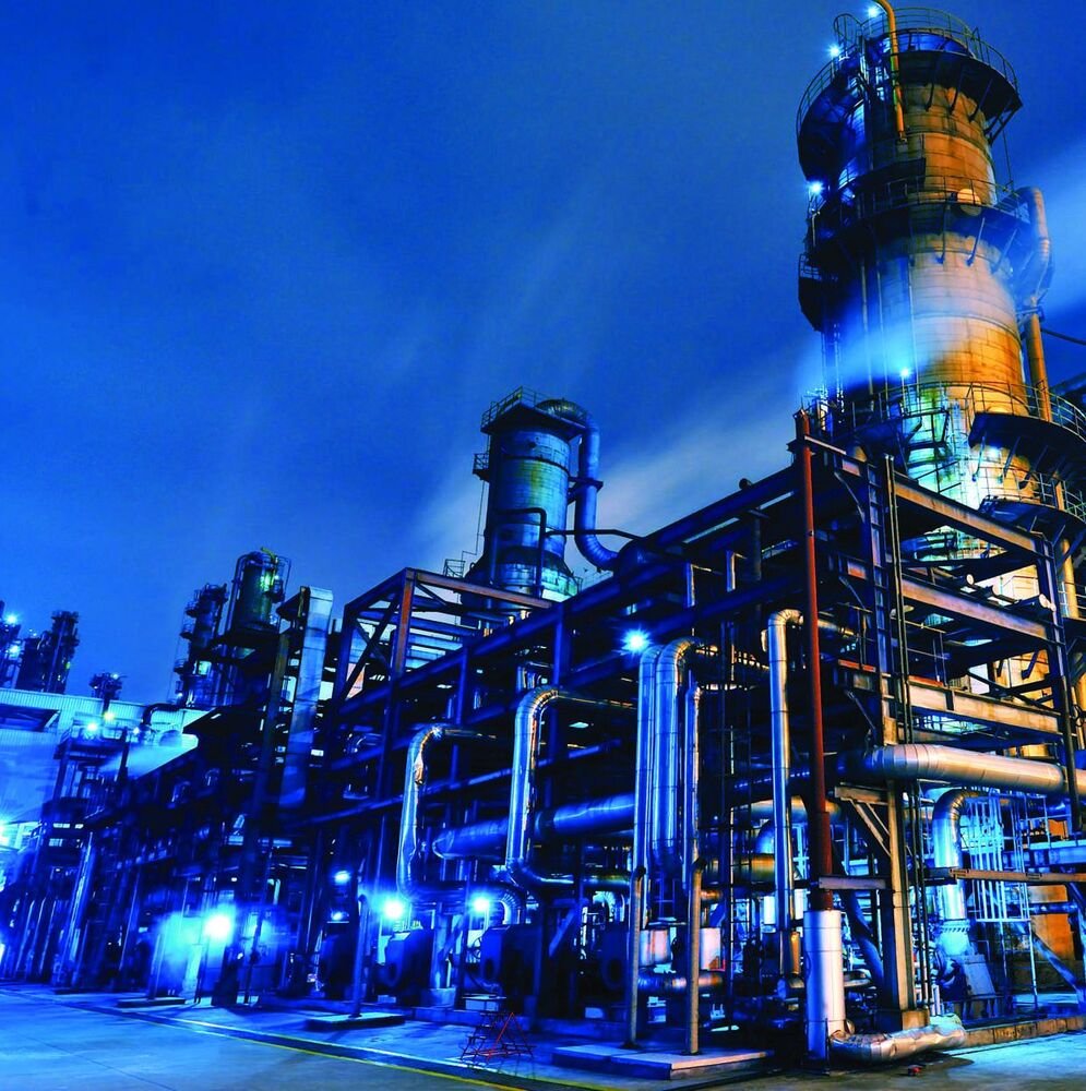 Petrochemical plant illuminated at dusk