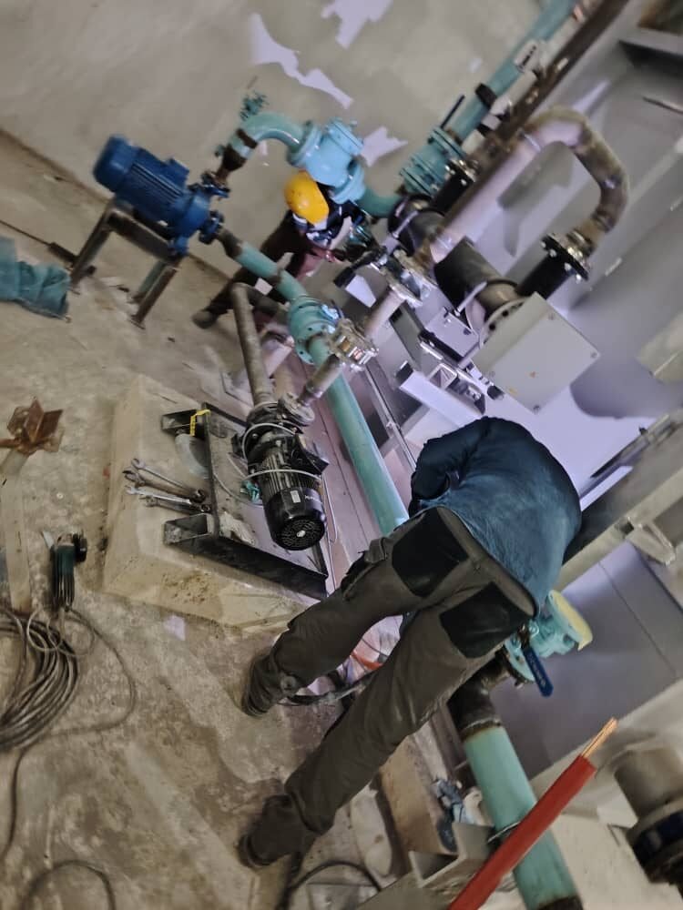 Pump and pipework skid being set out and aligned on site
