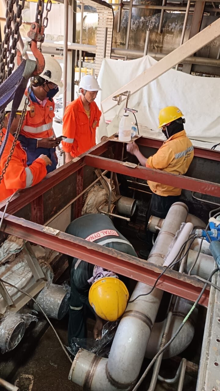 Rigging pipework down into a below-grade pump chamber