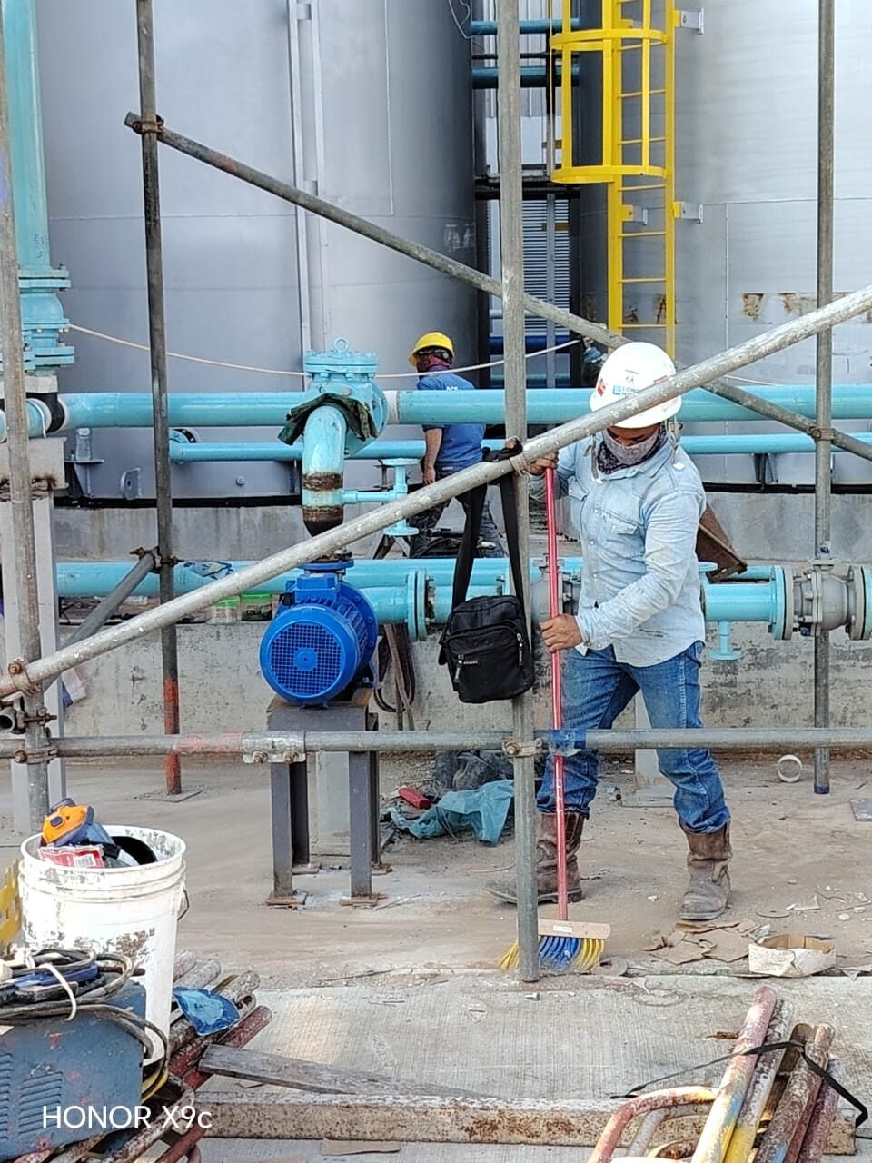 Pump and valve pipework taking shape at the base of a tank farm