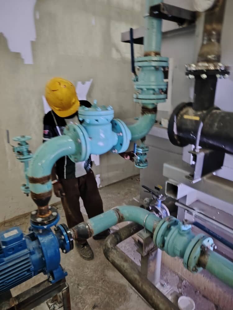 Check valve, isolation valve and pump connection assembled on site