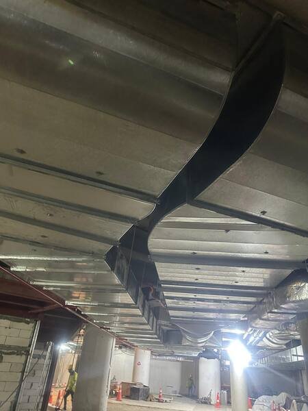 Mitred offset taking the duct main around a structural beam