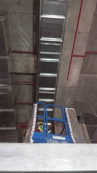 Duct riser and branch connections in a basement car park