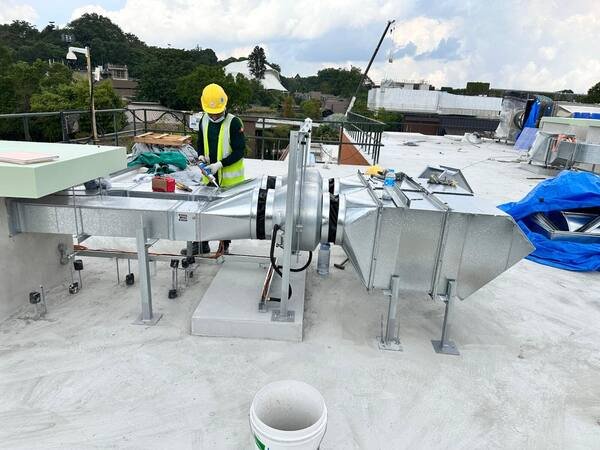Rooftop fan and ductwork installed on plinths