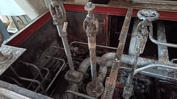 Galvanised pipework and supports installed in a sump