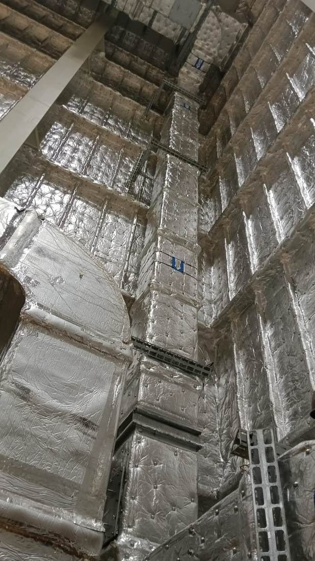 Vertical insulated duct riser routed up a building core