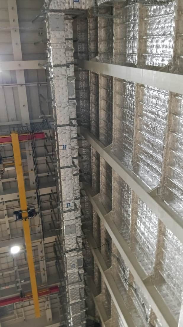 Insulated duct riser with branch connections in a services shaft